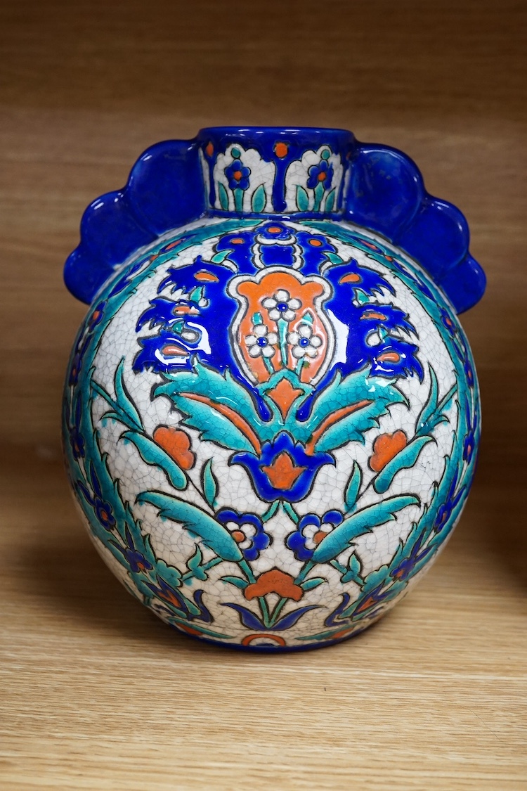 Two Persian vases and a mug, decorated with stylised flowers together with a Laroche Belgium Persian style vase, tallest 28.5cm. Condition - fair to good